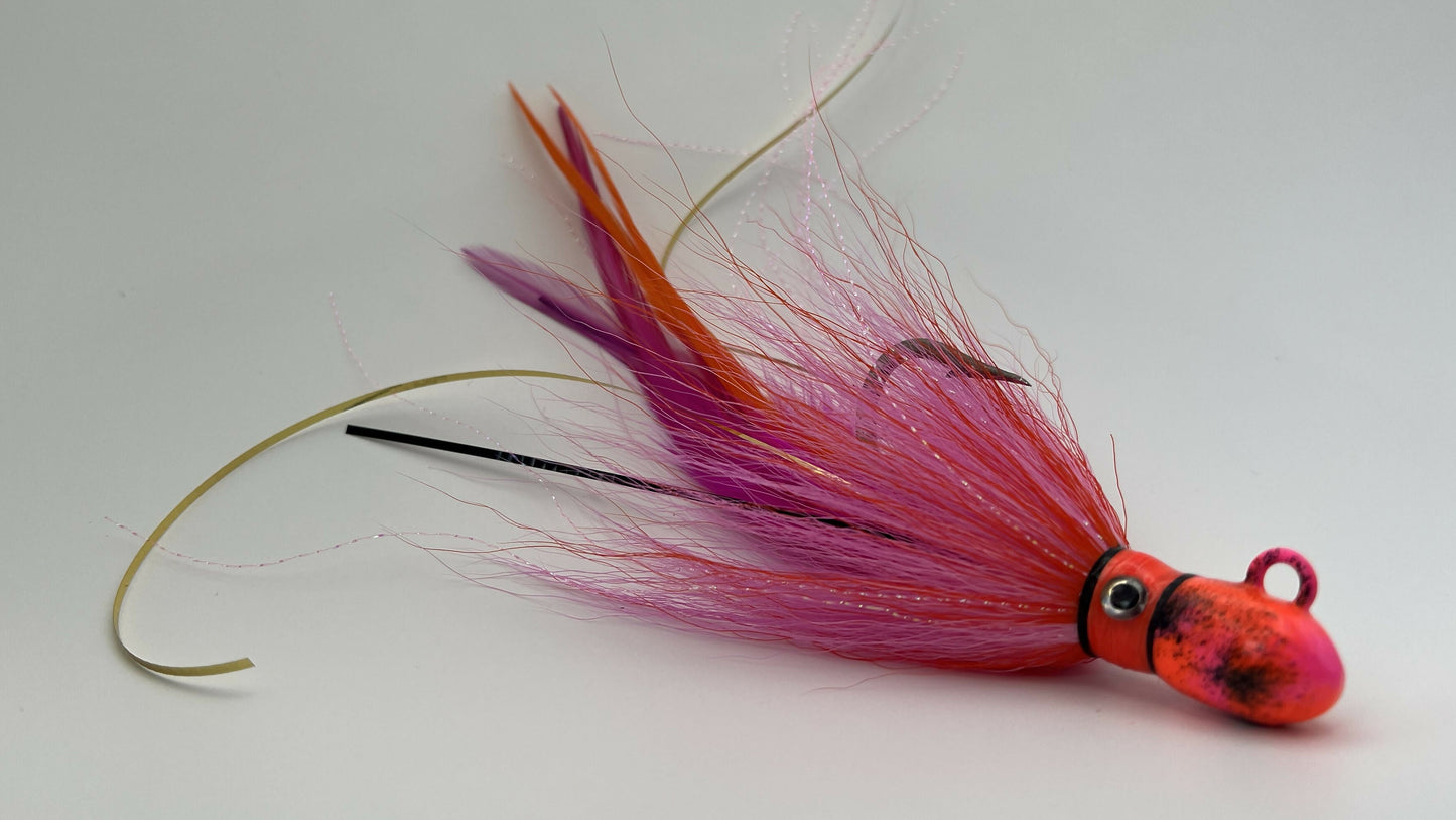Fishing lure with pink and orange colors on a white background